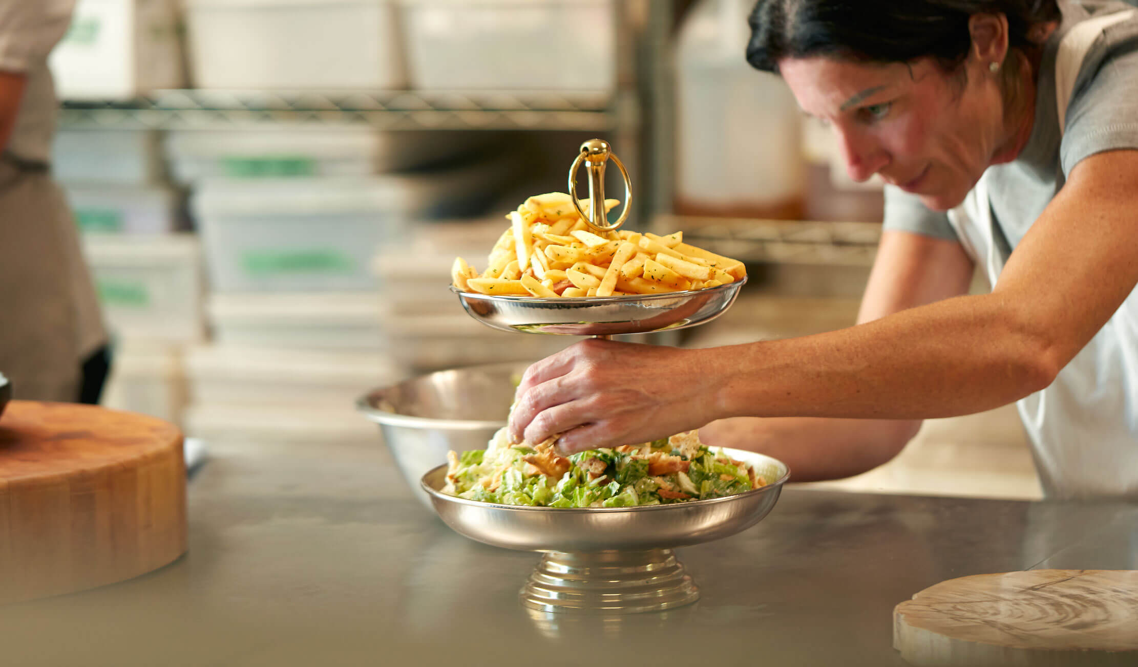 Kimberly McCune Gibson and a salad and french fry tower.